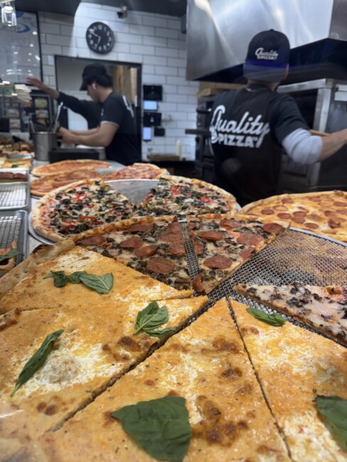 pizza slices ready to go at Quality Pizza Co in Hoboken 